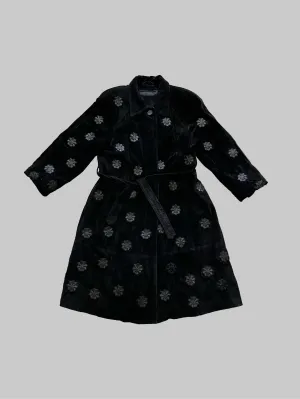 Upcycled leather coat with structures