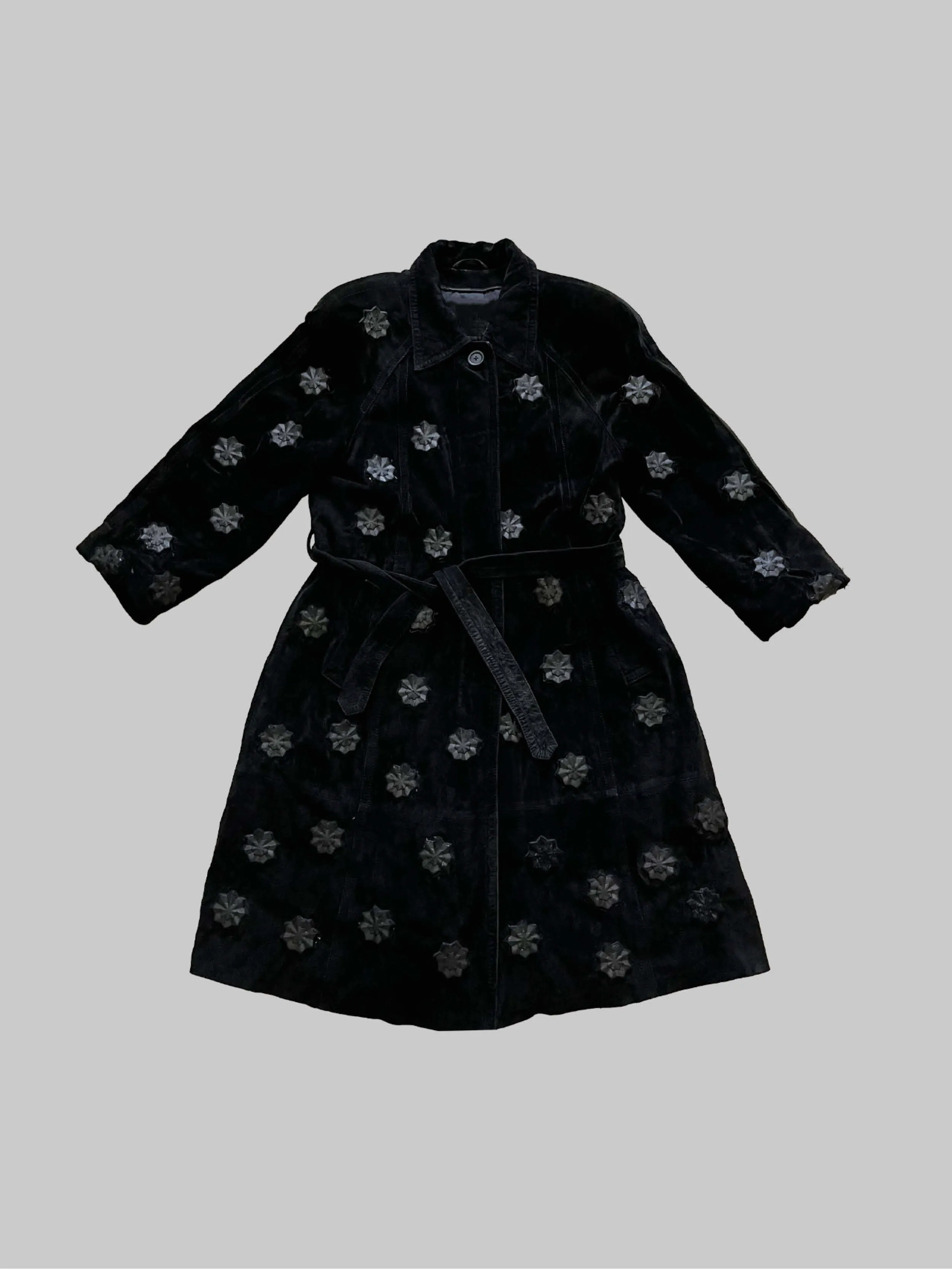 Upcycled leather coat with structures